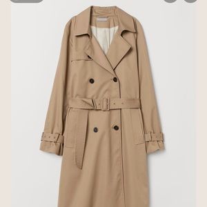 H & M woman’s trench coat in black and beige. Never worn, with tags.